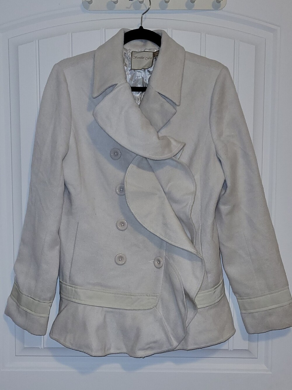 Fumbling Foe Ruffle Front Peacoat.